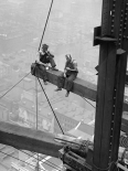 Workers Sitting on Steel Beam